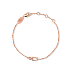 A rose gold bracelet with small cubic zirconia stones, featuring a chain link design.