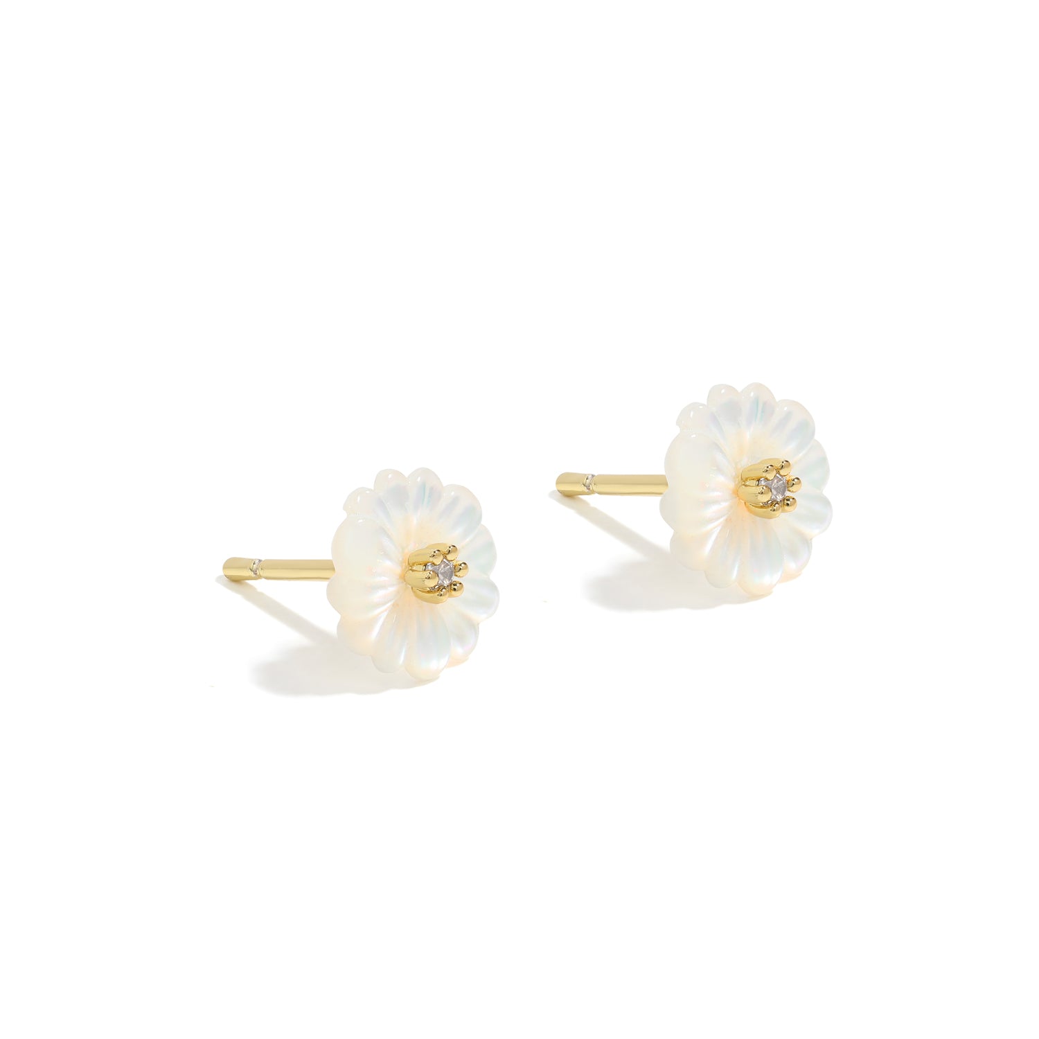 Simple and dainty studs. Gold earrings set with cubic zirconia stones.