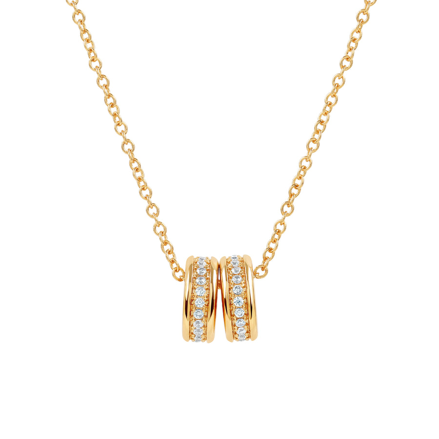 Elegant and minimalist gold pendant necklace set with cubic zirconia stones.