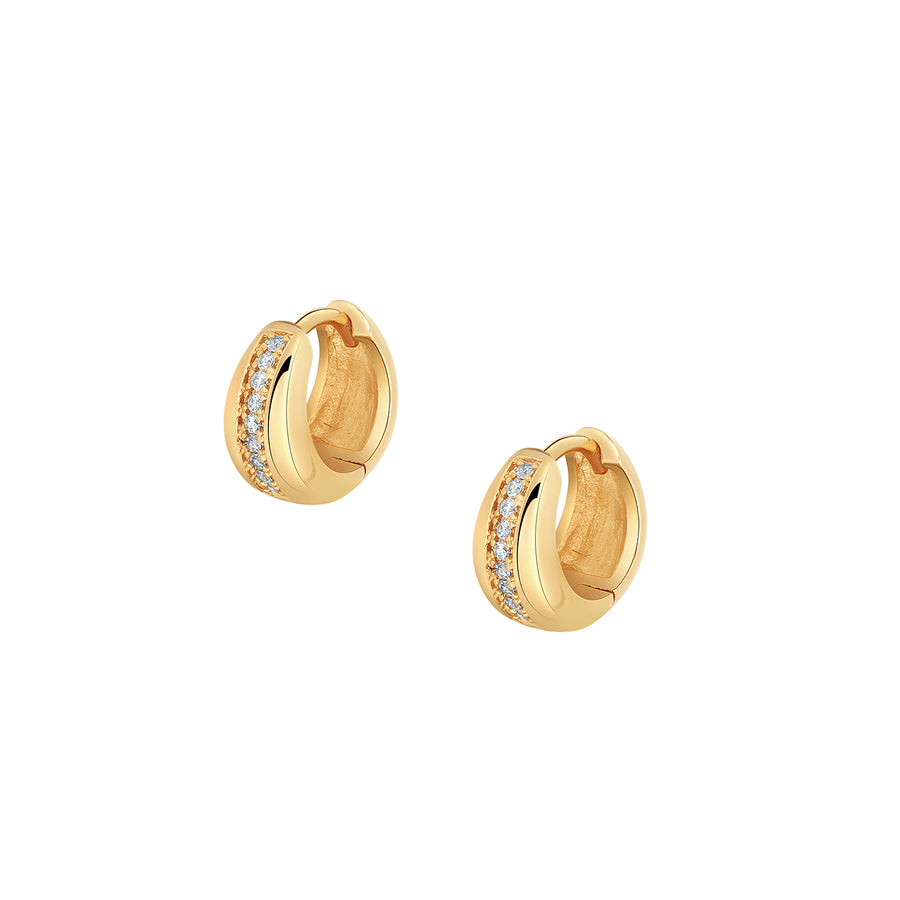 Elegant and statement earrings. Gold huggies set with cubic zirconia stones.