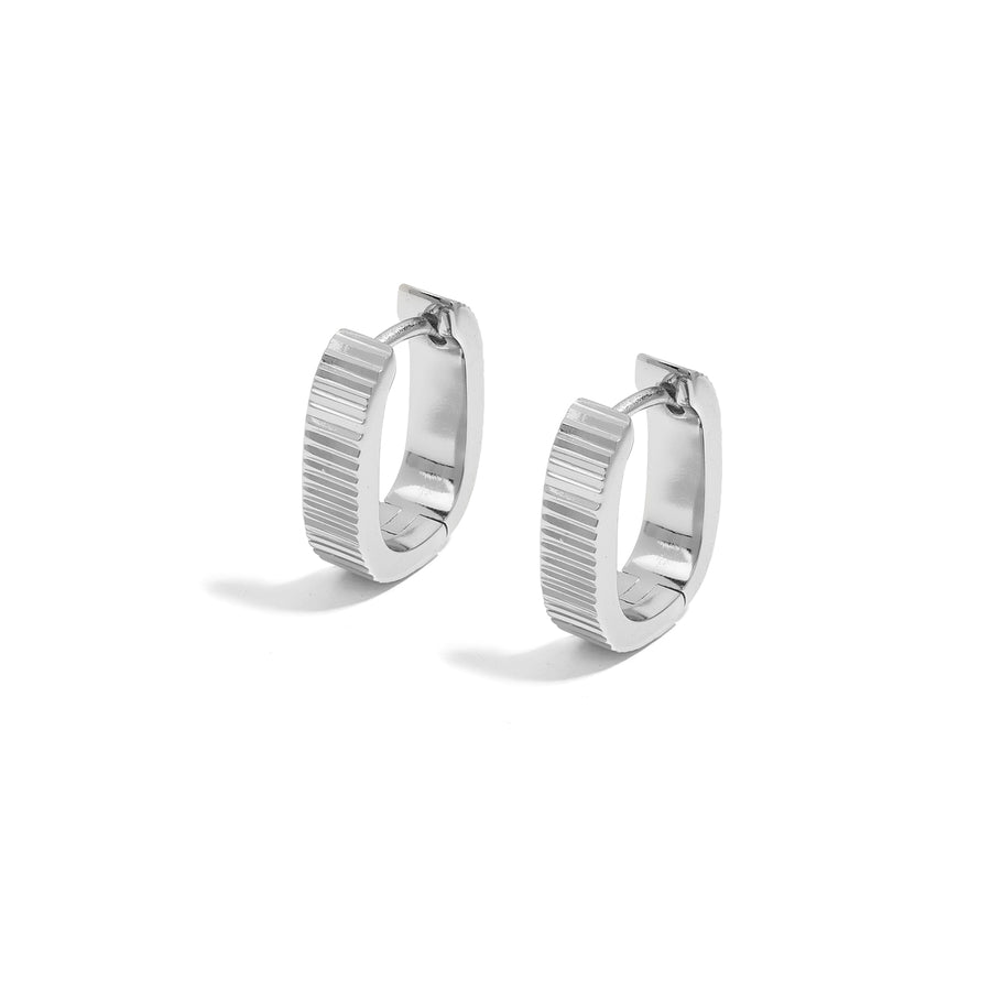 Elegant and minimalist earrings. Silver rounded huggies.