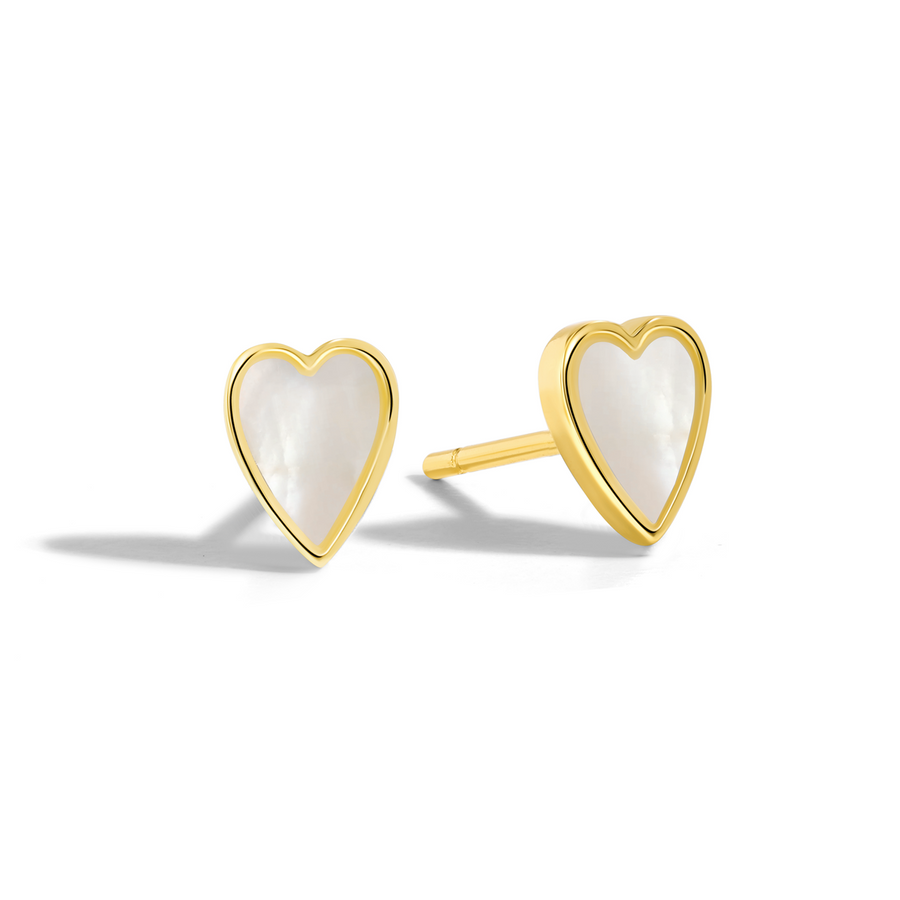 Charming and dainty earrings. Gold heart-shaped studs with mother of pearls.