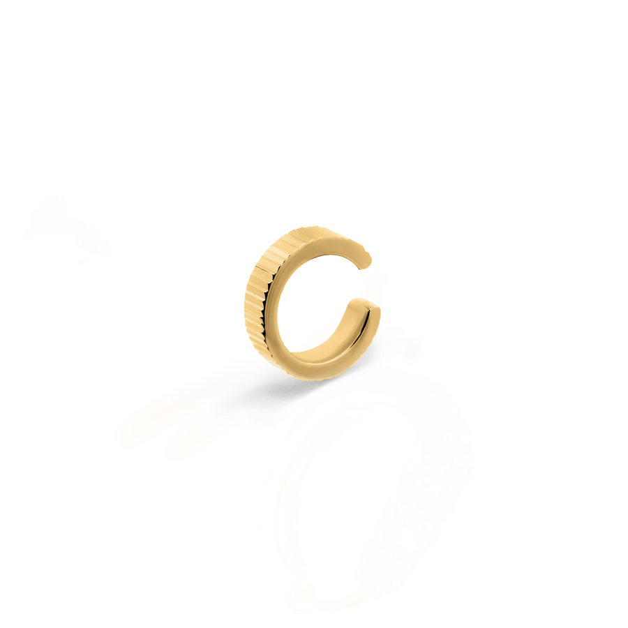 Elegant and statement textured ear cuff in gold.