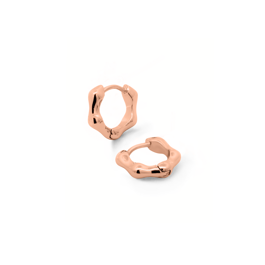 Minimalist and sleek earrings. Rose gold huggies.