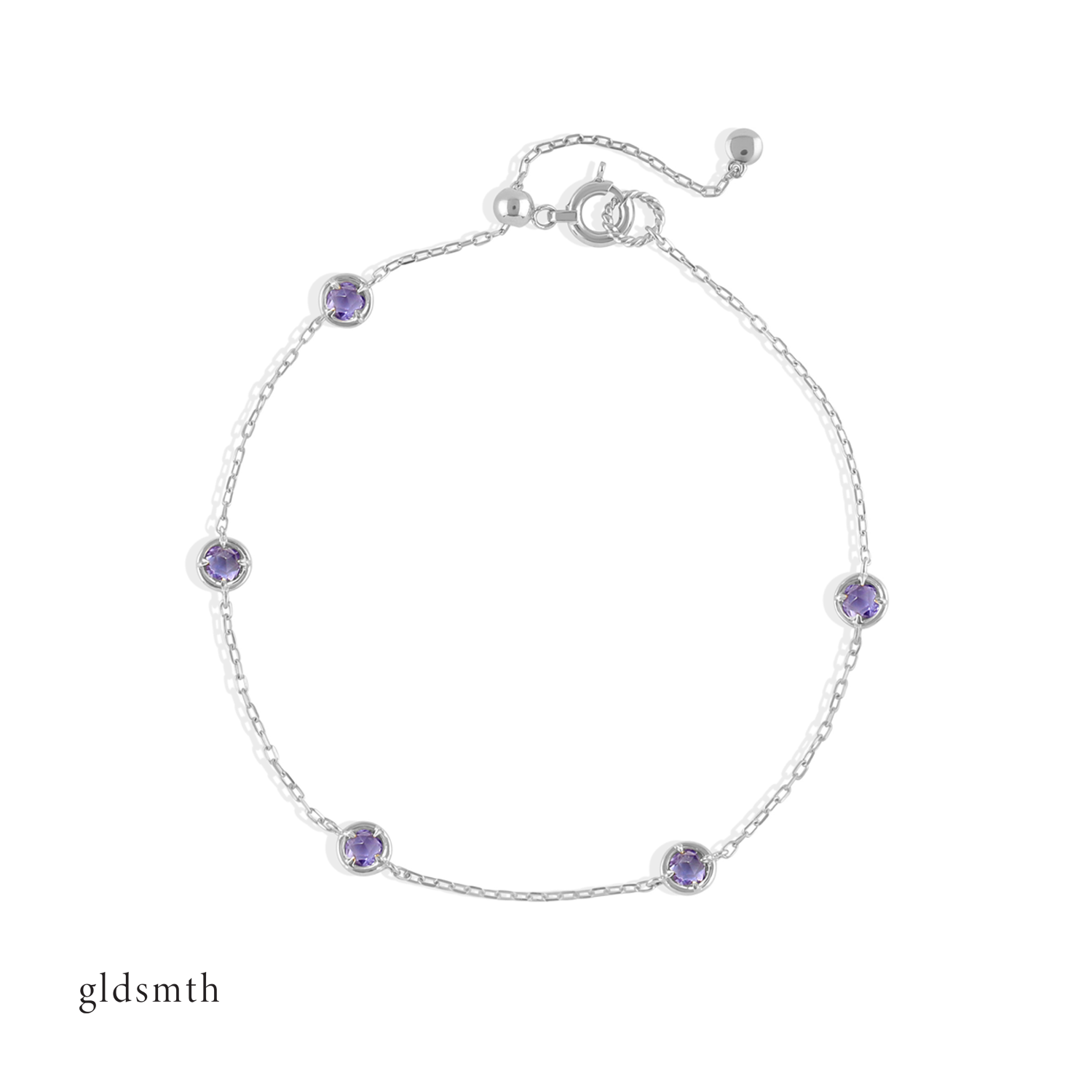 Elegant and fine handcrafted 10k solid white gold bracelet with tanzanite.