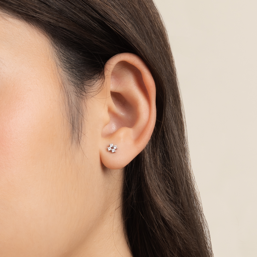 Model is wearing elegant and dainty earrings in 925 silver with cubic zirconia