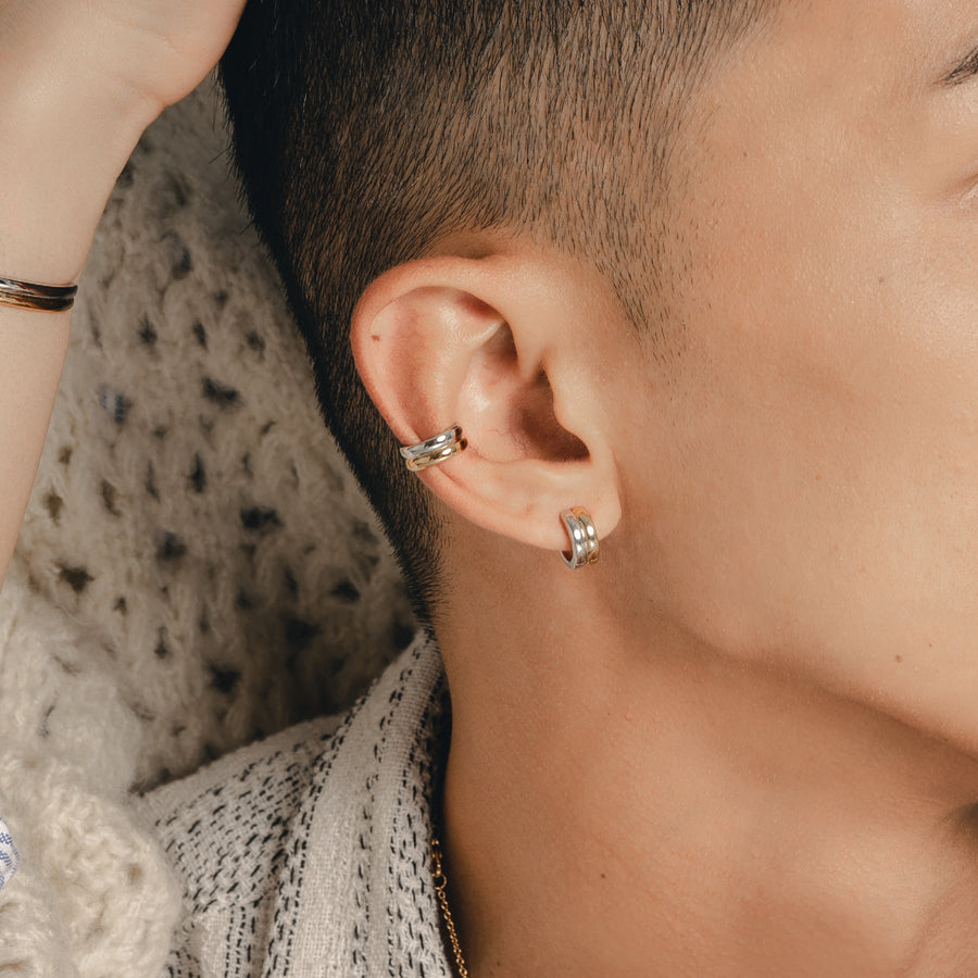 Model is wearing minimalist and sleek ear cuff in 925 silver.