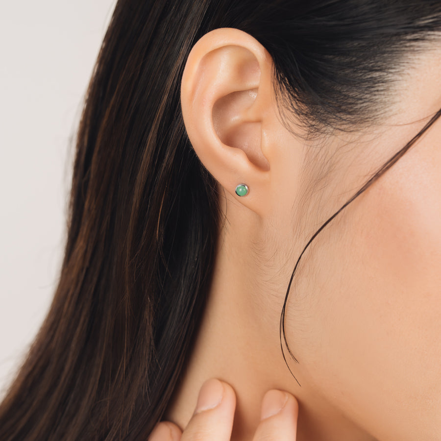 Fine and dainty studs. Model is wearing solid white gold earrings set with chrysoprase gemstones