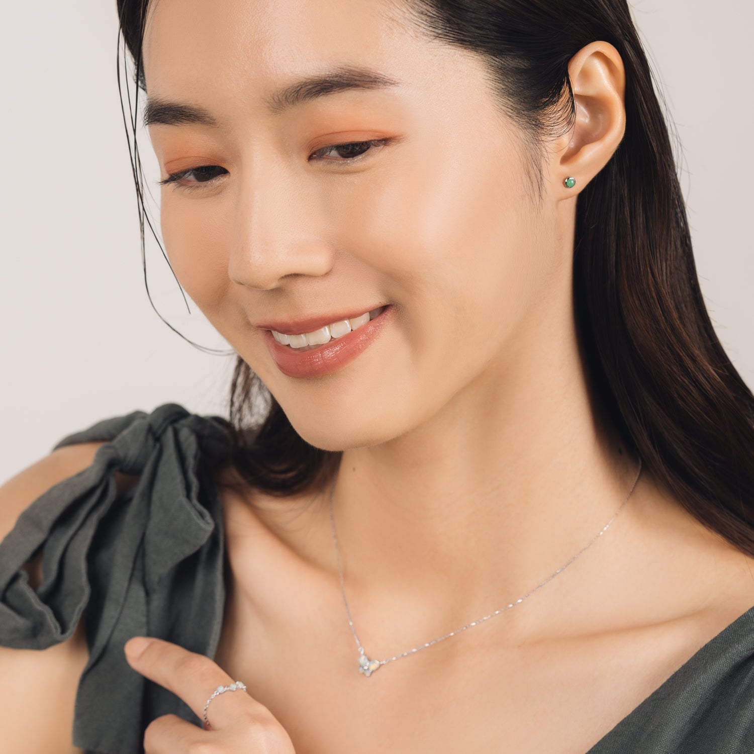 Fine and dainty studs. Model is wearing solid white gold earrings set with chrysoprase gemstones