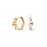 Minimalist and dainty earrings. Gold huggies set with cubic zirconia stones.