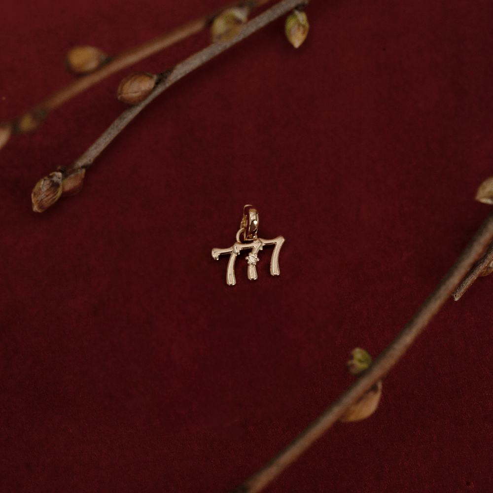 Gold 777 Charm
