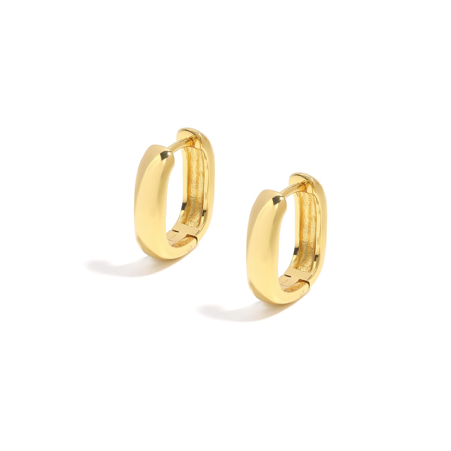 Elegant and minimalist earrings. Gold rounded huggies.