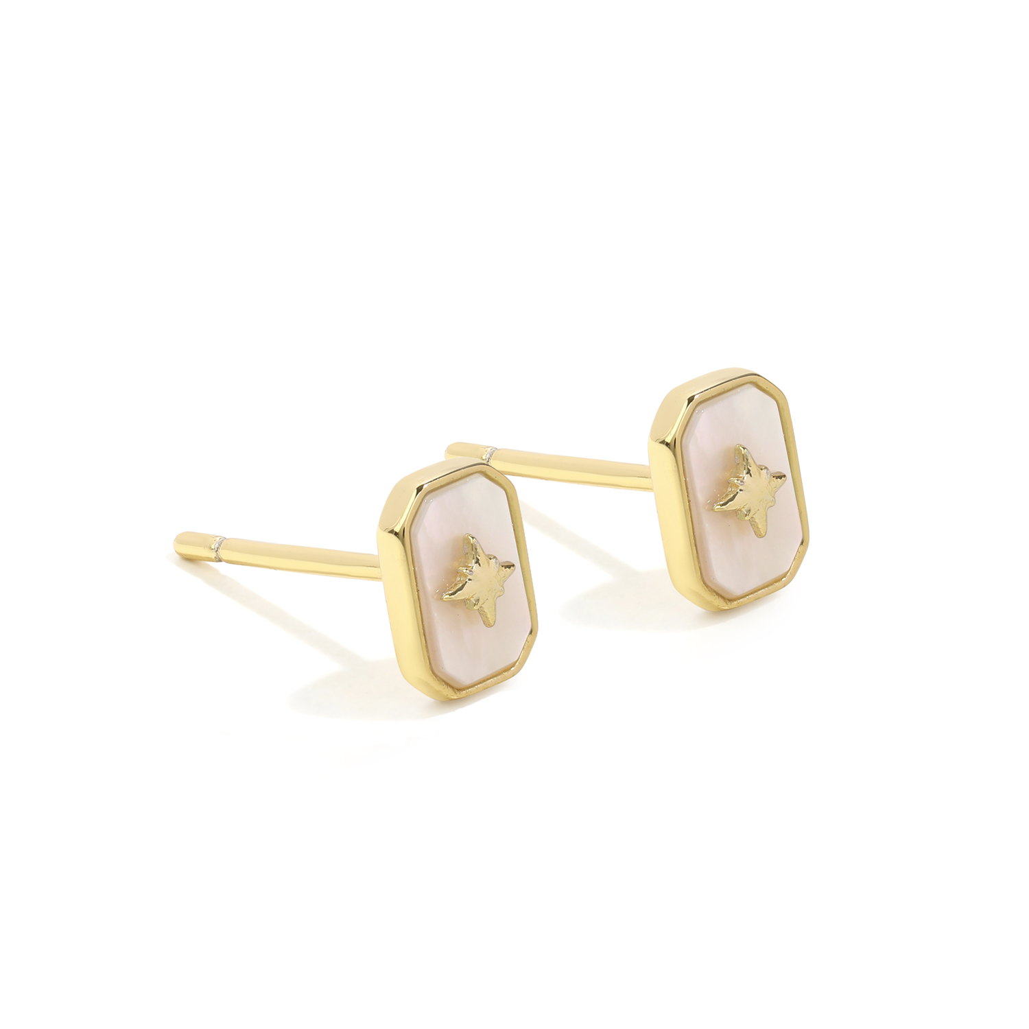 Simple and dainty studs. Gold earrings set with mother of pearl.