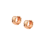 Clean and minimalist huggies in rose gold.