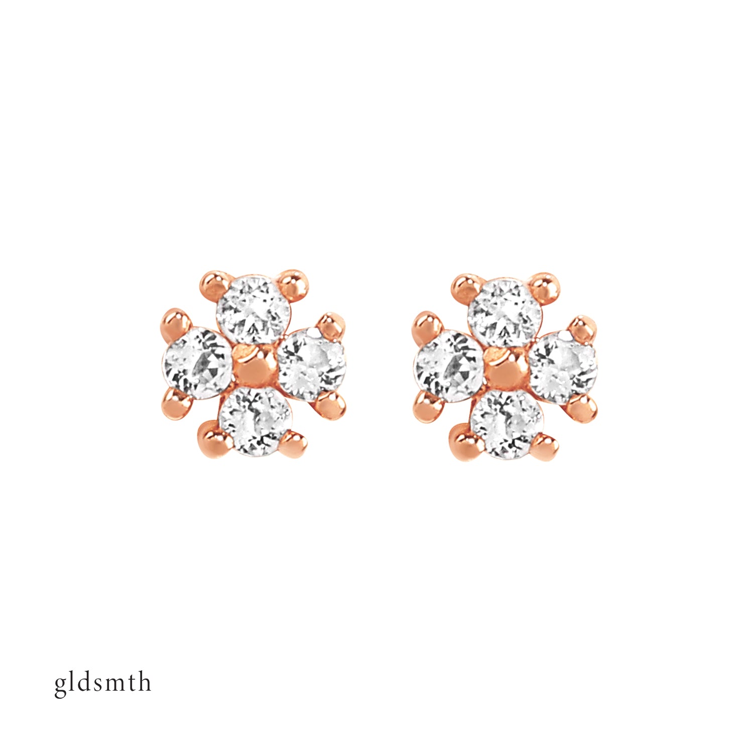 Elegant and fine earrings. Handcrafted 14k solid rose gold studs with white topazes.