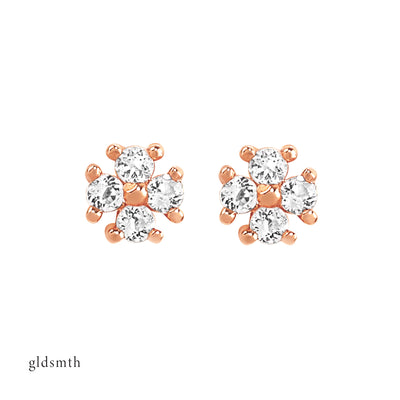 Elegant and fine earrings. Handcrafted 14k solid rose gold studs with white topazes.