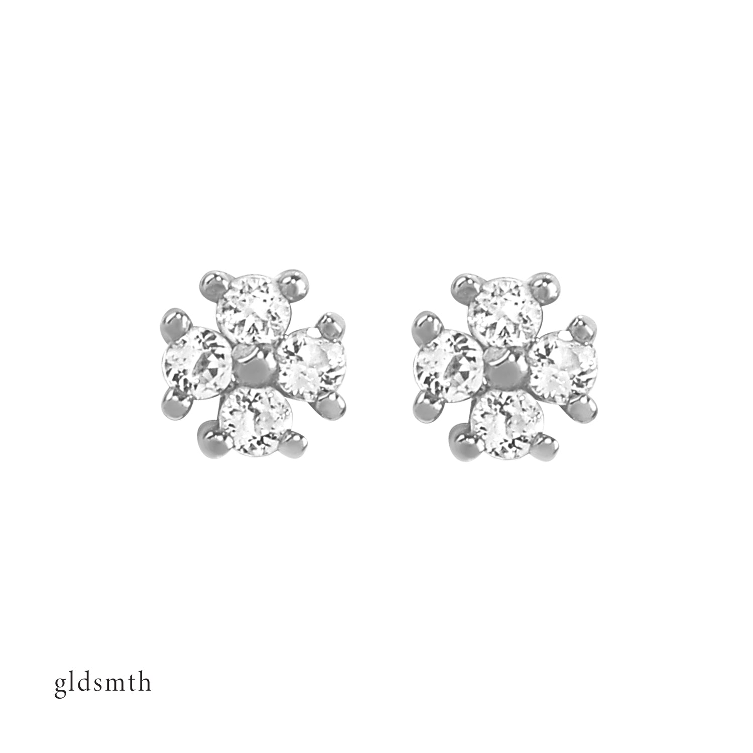Elegant and fine earrings. Handcrafted 14k solid white gold studs with white topazes.