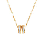 Elegant and minimalist gold pendant necklace set with cubic zirconia stones.