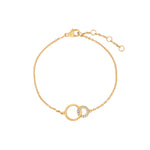 Elegant and minimalist gold pendant bracelet set with cubic zirconia stones.