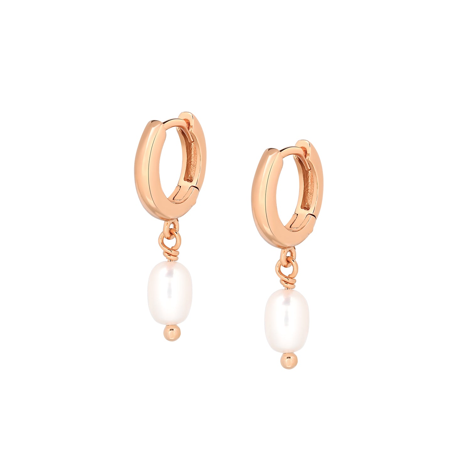 Elegant and statement earrings. Rose gold drop huggies set with pearls.