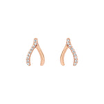 Elegant and statement earrings. Rose gold wishbone studs set with cubic zirconia stones.