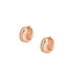 Elegant and statement earrings. Rose gold huggies set with cubic zirconia stones.