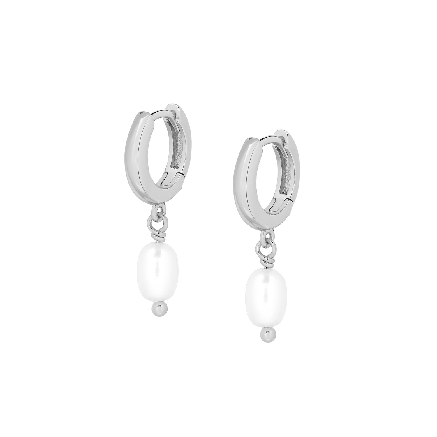 Elegant and statement earrings. 925 silver drop huggies set with pearls.