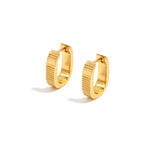 Elegant and statement earrings. Gold rounded huggies.