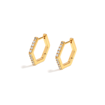 Elegant and statement earrings. Gold hexagonal huggies set with cubic zirconia stones.