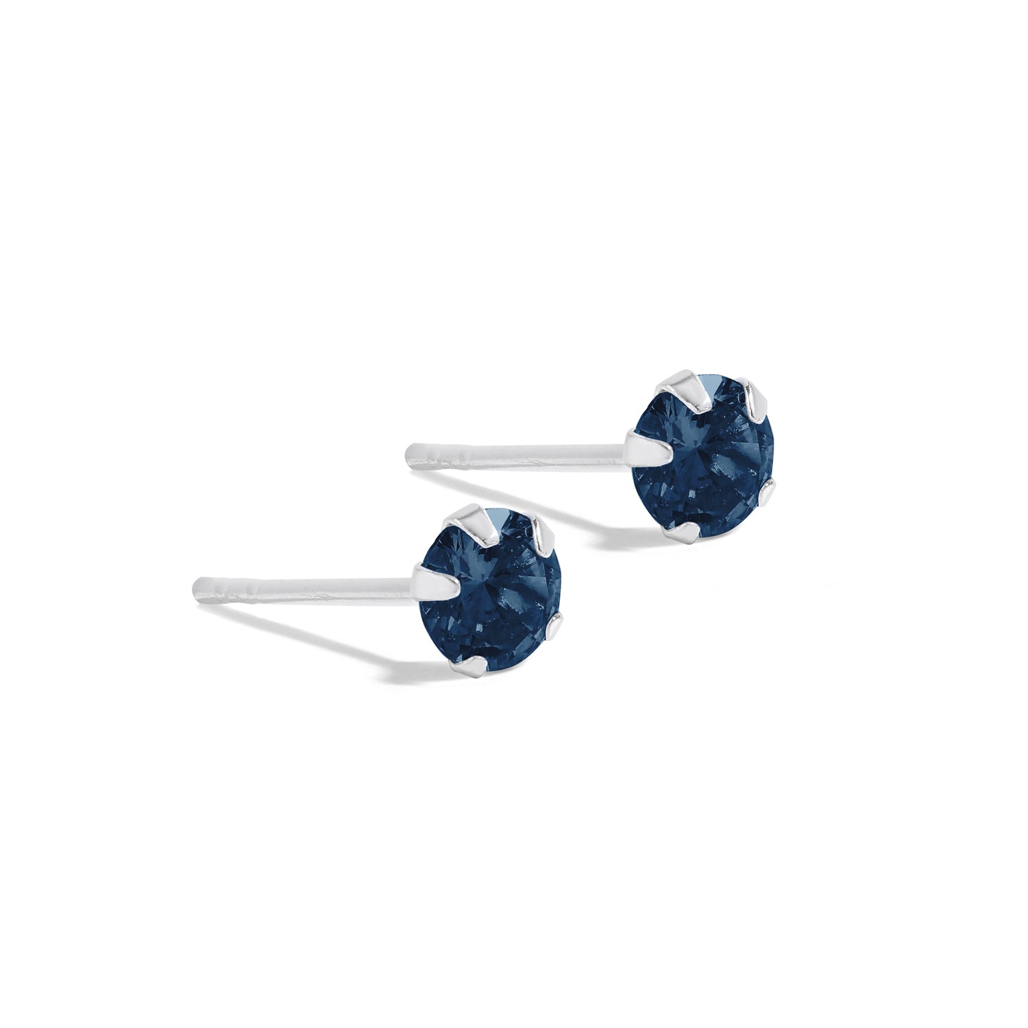 Minimalist and elegant earrings. 925 silver ear studs set with sapphire cubic zirconia stones.