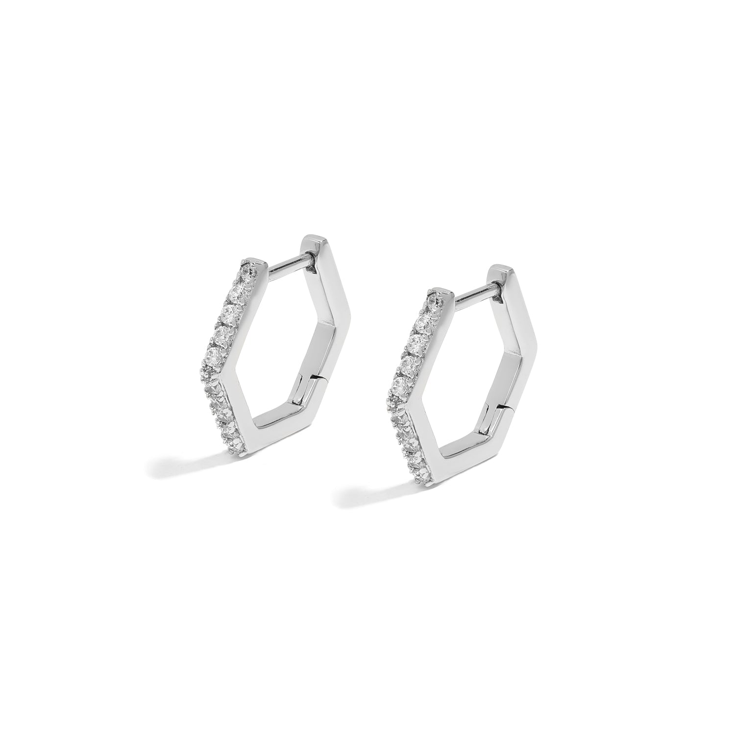 Elegant and statement earrings. Silver hexagonal huggies set with cubic zirconia stones.