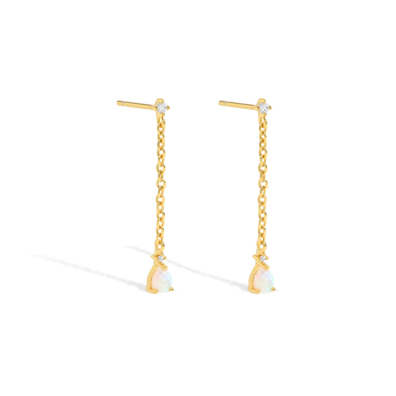 Elegant and statement drop earrings. Gold studs set with opals and cubic zirconia stones.