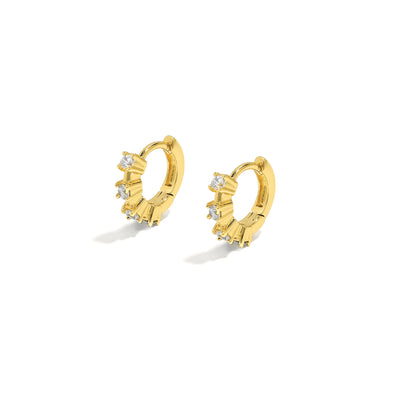 Elegant and statement huggies. Gold hoop earrings set with cubic zirconia stones.