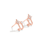 Elegant and statement studs. Rose gold hoop earrings set with cubic zirconia stones.