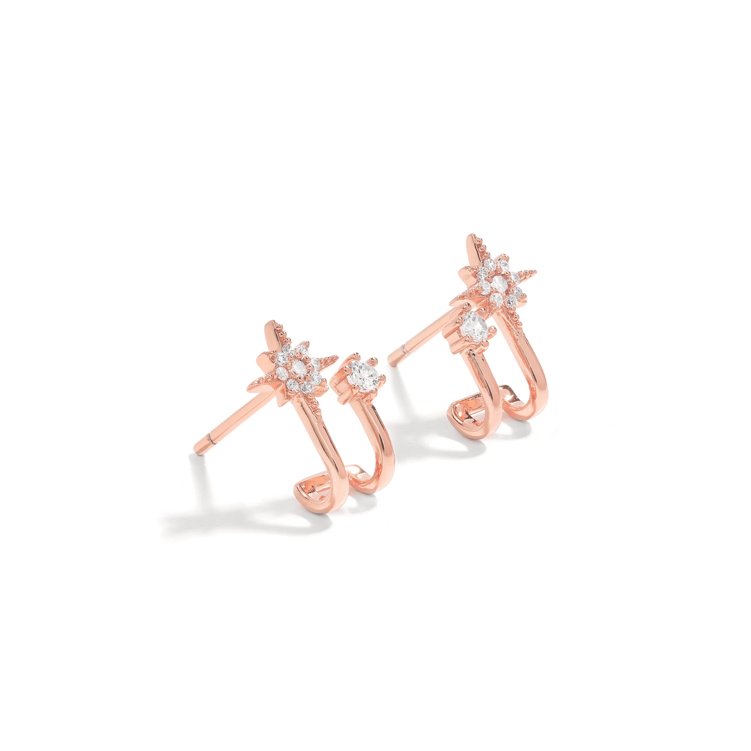 Elegant and statement studs. Rose gold hoop earrings set with cubic zirconia stones.