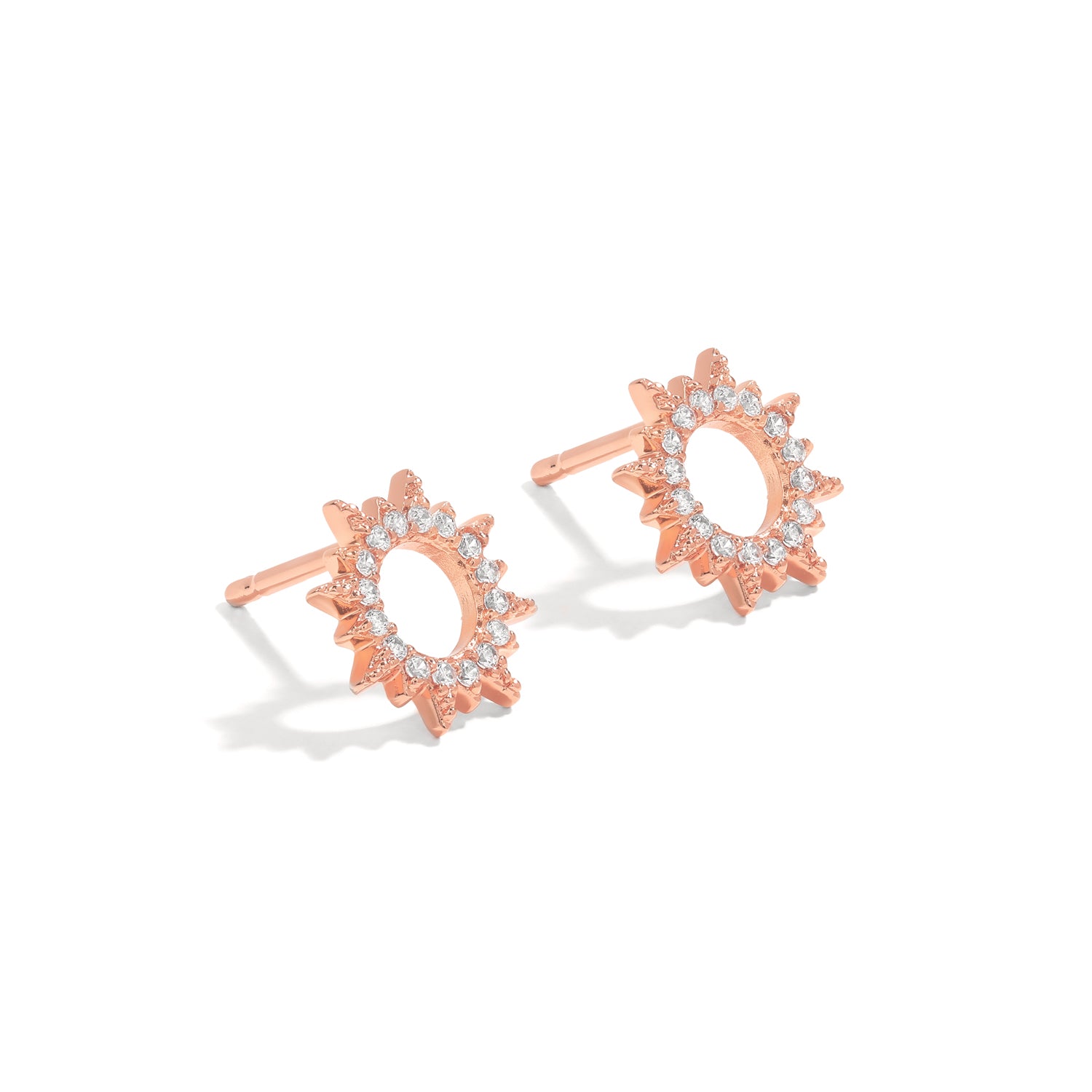Elegant and statement studs. Rose gold earrings set with cubic zirconia stones.
