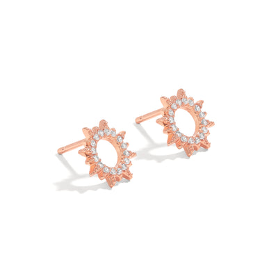 Elegant and statement studs. Rose gold earrings set with cubic zirconia stones.