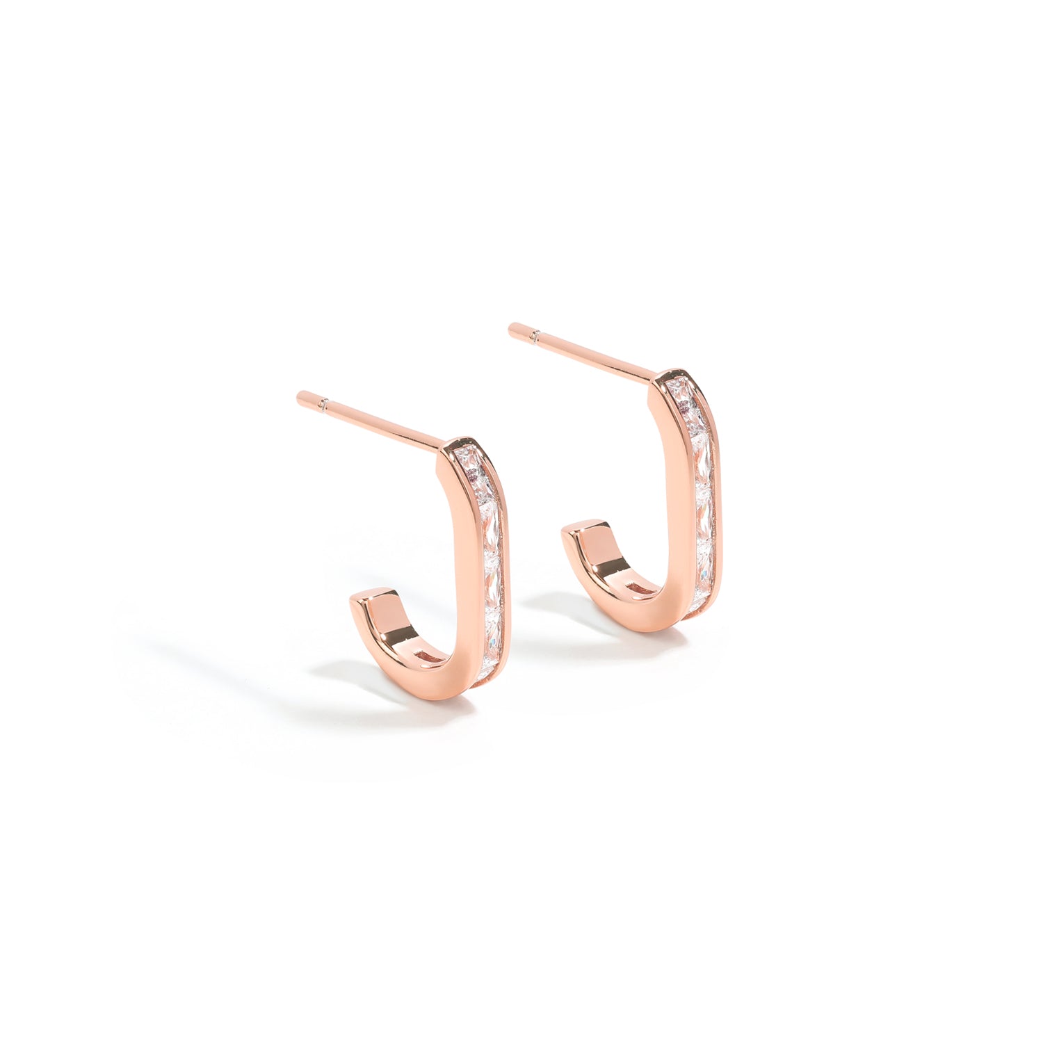 Minimalistic yet bold earrings. Rose gold stud hoops with cubic zircona stones