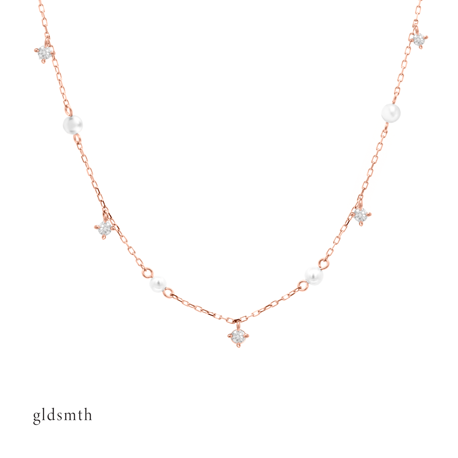 Timeless and elegant hand crafted 10k solid rose gold necklace with freshwater pearls and conflict-free diamonds.