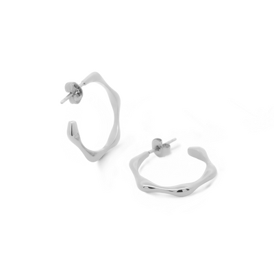 Minimalist and sleek earrings. Silver hoops.