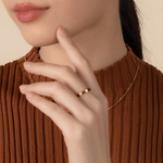 Model is wearing elegant and statement textured ring in gold.