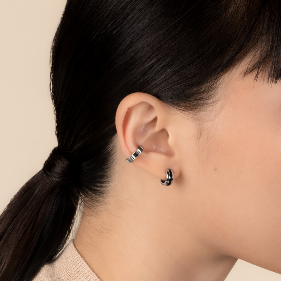 Model is wearing elegant and statement textured ear cuff in 925 silver.