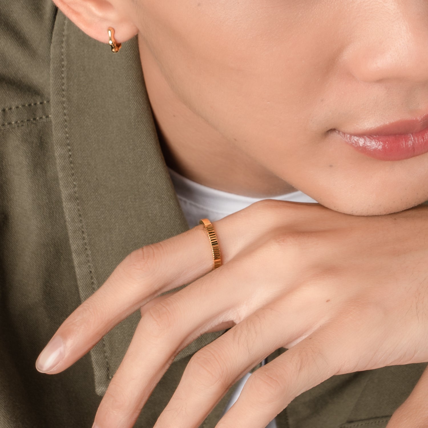 Model is wearing elegant and statement textured ring in gold.