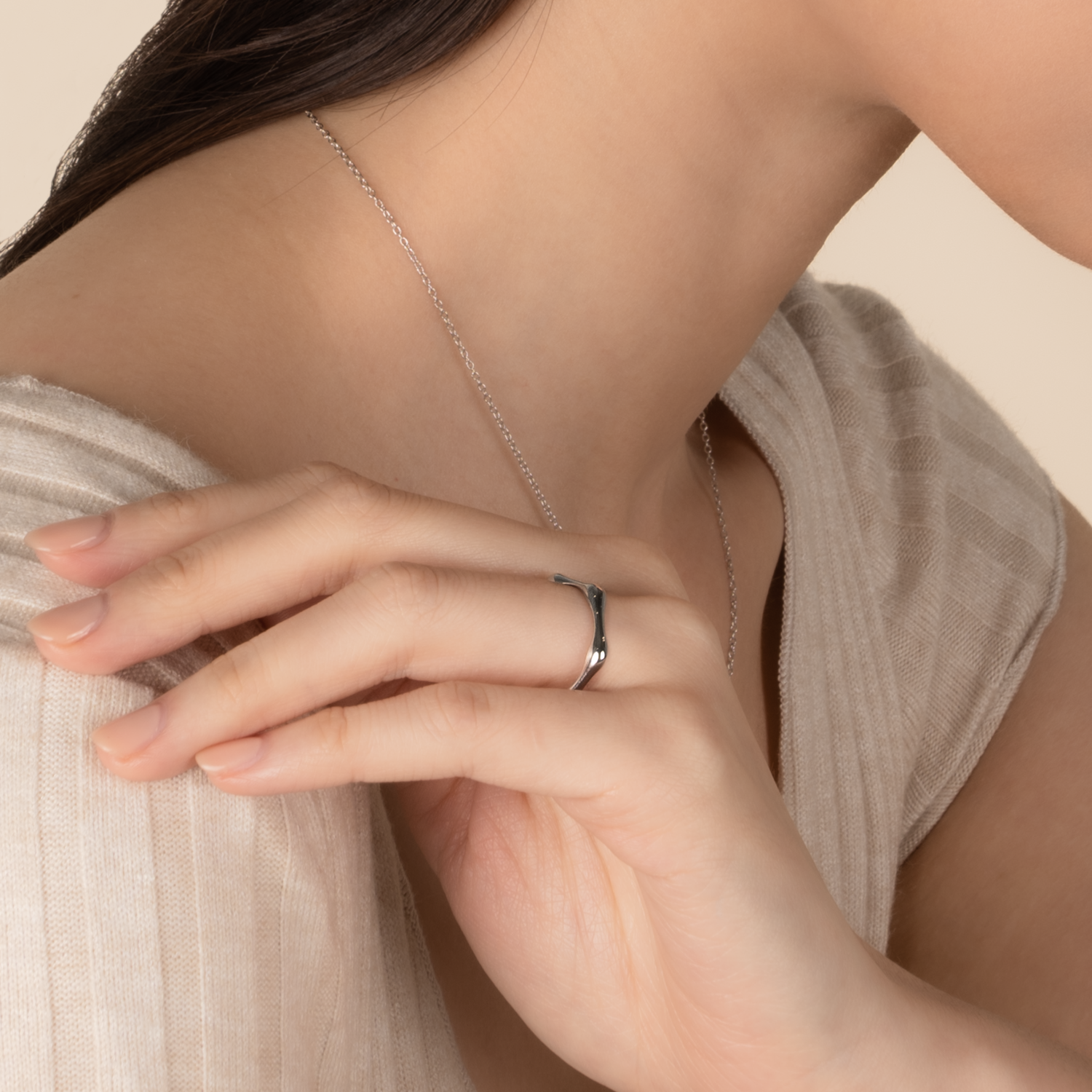 Model is wearing minimalist and sleek ring in 925 silver.