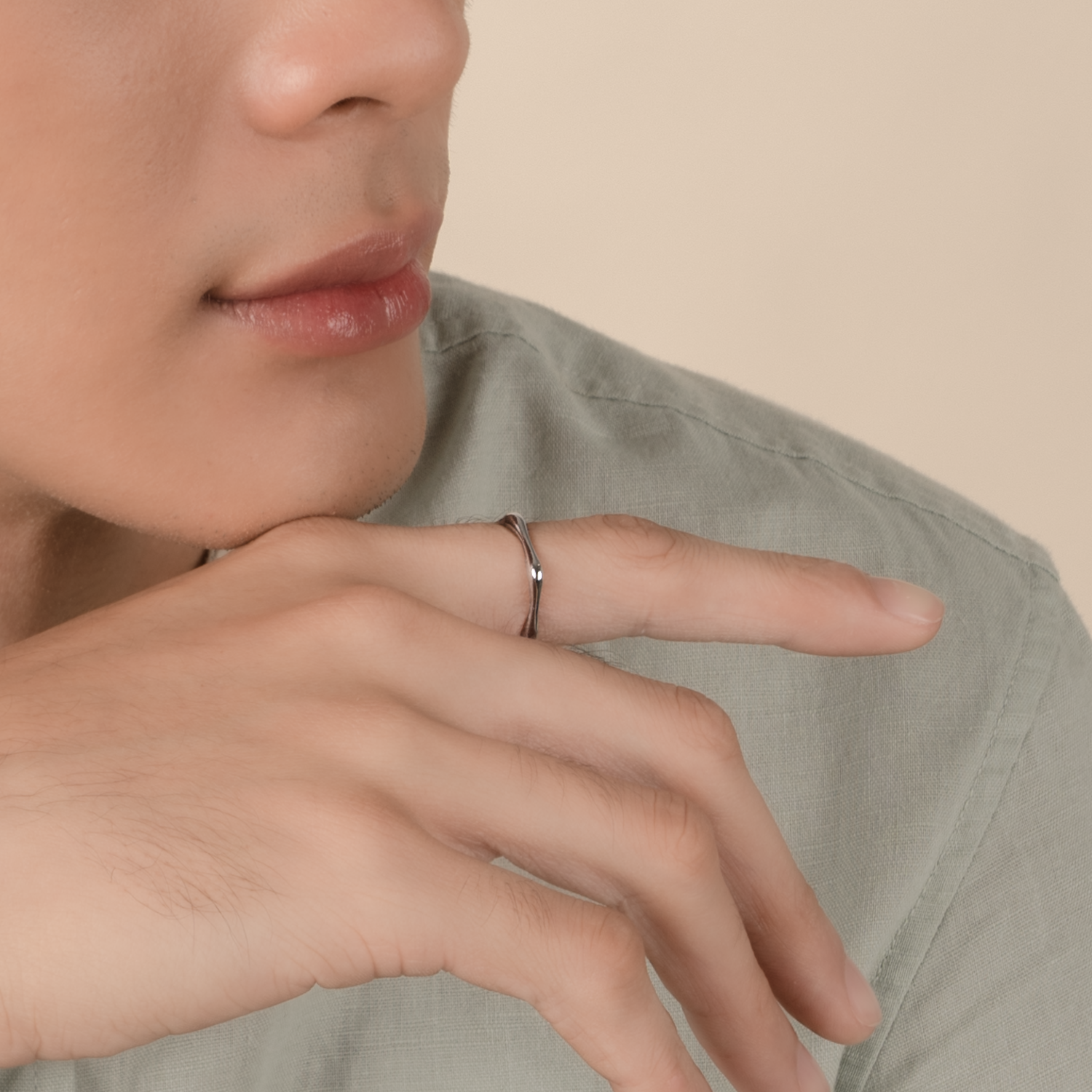 Model is wearing minimalist and sleek ring in 925 silver.