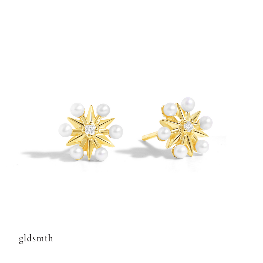 Dainty and fine earrings. Handcrafted 10k solid gold studs with conflict-free diamonds and freshwater pearls.