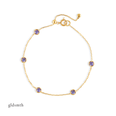 Elegant and fine handcrafted 10k solid gold bracelet with tanzanite.