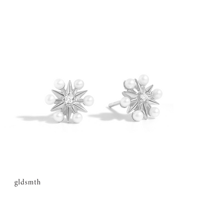 Dainty and fine earrings. Handcrafted 10k solid white gold studs with conflict-free diamonds and freshwater pearls.