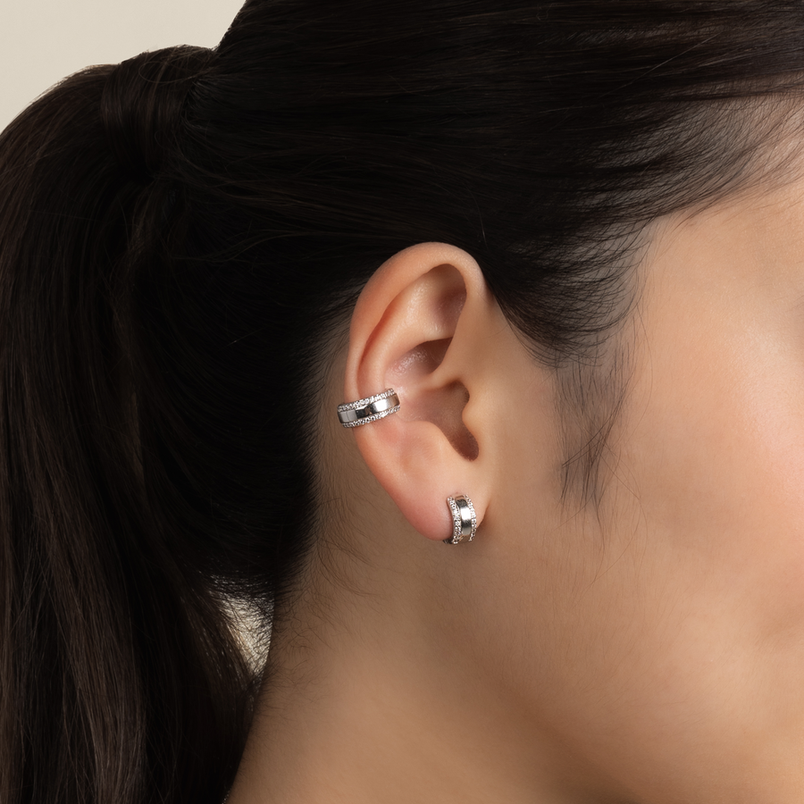 Model wears classic and elegant ear cuff in silver with cubic zirconia.