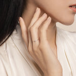 Elegant and fine ring. Model wears handcrafted 14k solid white gold ring with white topazes.